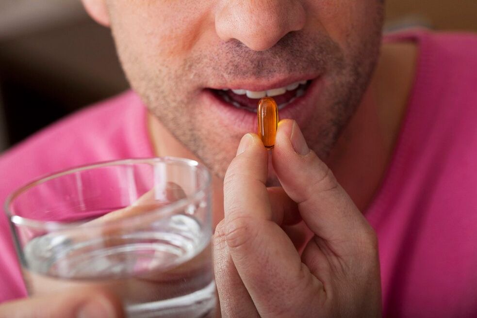 a man takes vitamins to improve nervous system function